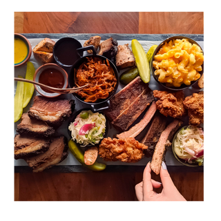 A picture of our introductory bundle items featuring mac n cheese, pulled pork, ribs, beef brisket and coleslaw