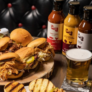 A picture of pulled BBQ sliders featuring chicken, pulled pork and beef brisket sliders. Perfect for family gatherings, canapes and corporate events.